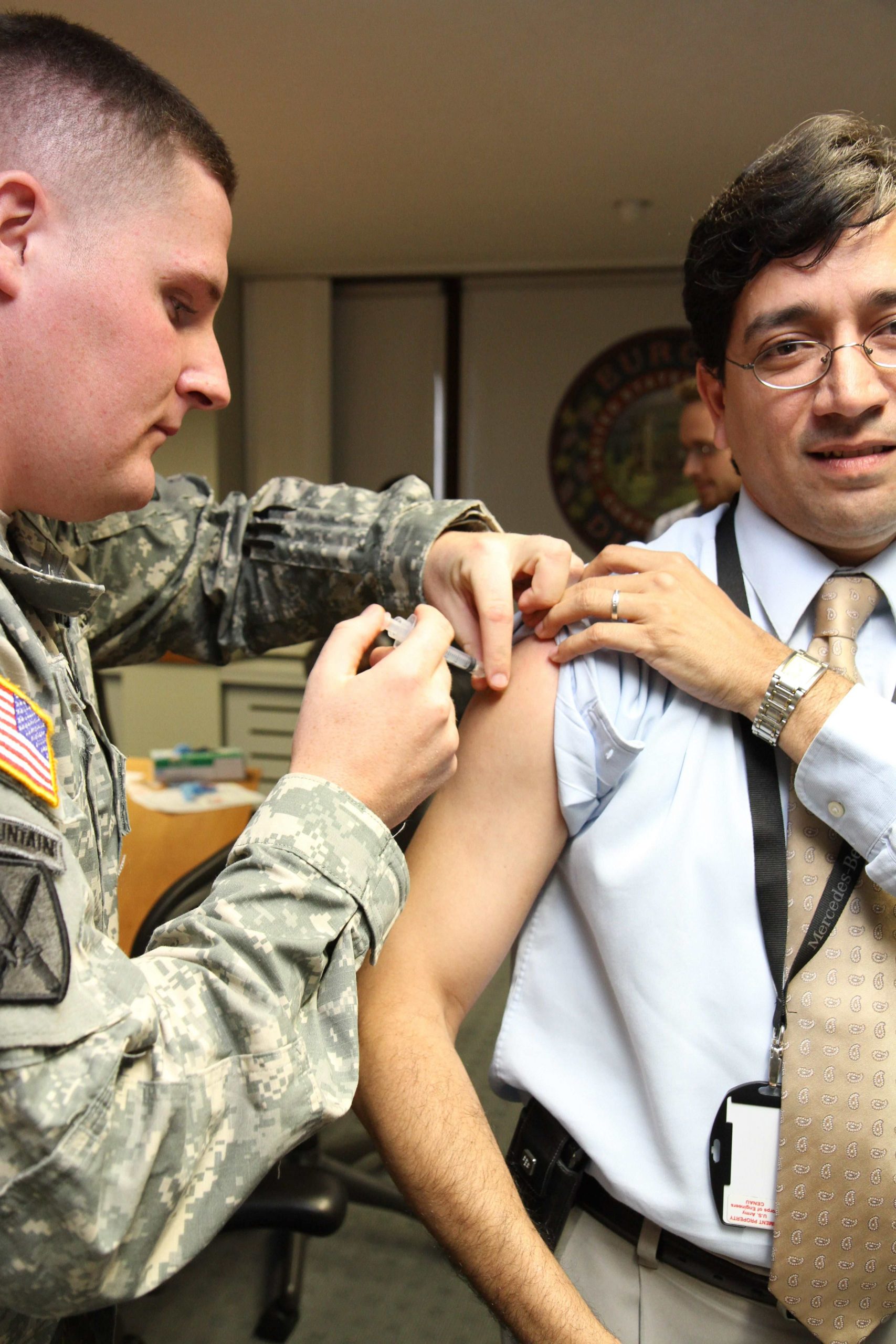 man getting injection - ClearHealthCosts